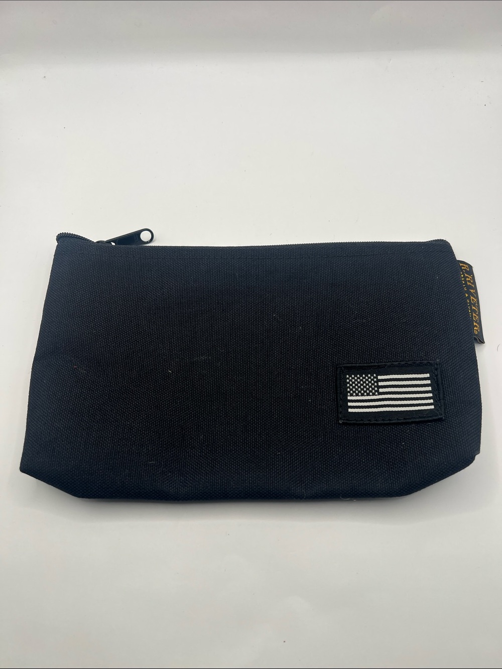 Black Canvas Toiletry Pouch with Monochrome Flag Accent R. Riveter